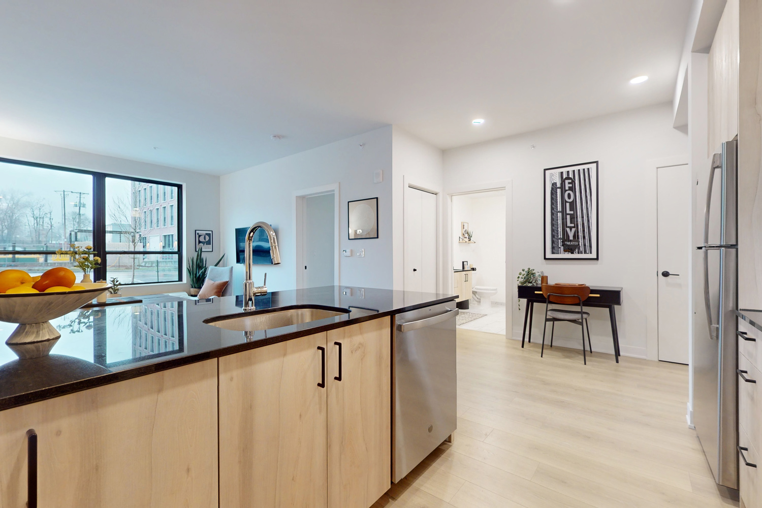 Apartments with Kitchen Island and Quartz Countertops at the Senate Apartments at the Crosswalks